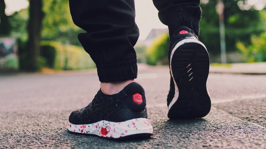 Person in Black Sneakers Walking on Street